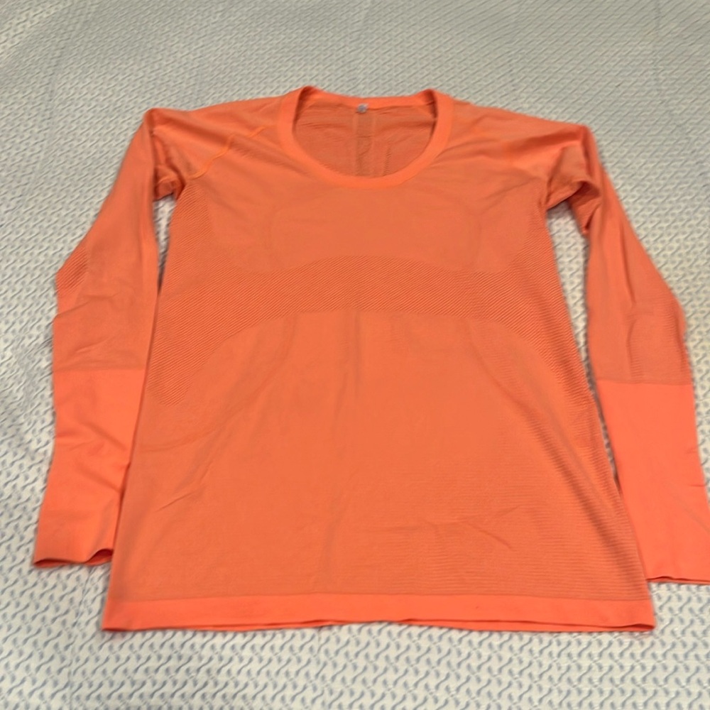 Lululemon swiftly tech bright orange long sleeve. Excellent condition size 10.